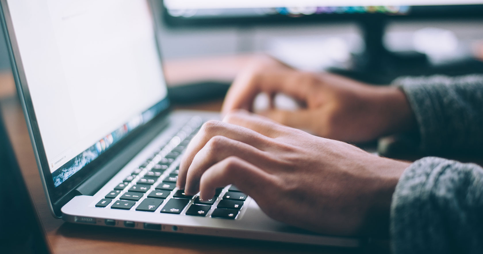 Person typing on a laptop
