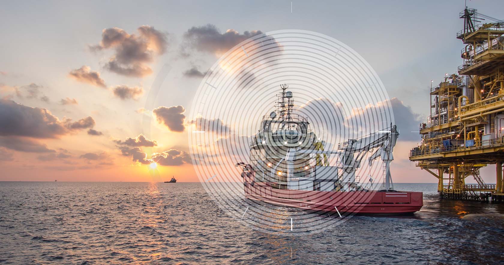 Ship at sea at sunset